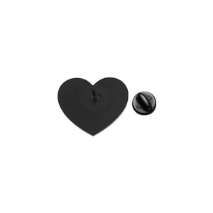 Close-up of heart-shaped pin back with matte black finish and rubber clutch fastener