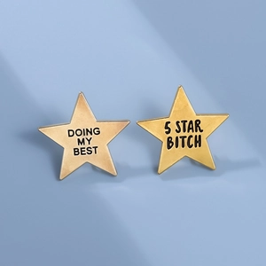 Elegant gold pentagram star badges featuring engraved inspirational letters on blue background