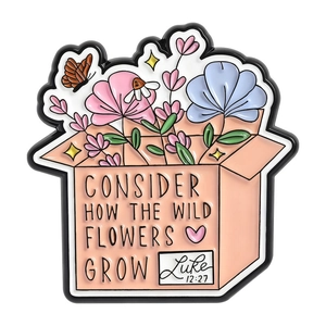 Wild flower box enamel pin with butterfly and Luke 12:27 quote on white background