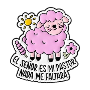 Pink cartoon sheep enamel pin with Spanish biblical text and floral nature elements