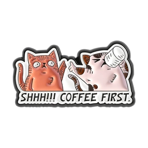 Creative cartoon enamel pin featuring two cats with Shhh Coffee First text badge
