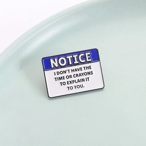 Blue rectangular enamel pin with humorous text NOTICE I don't have the time or crayons