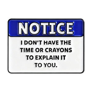 Funny blue enamel notice pin featuring sarcastic quote about explaining with crayons