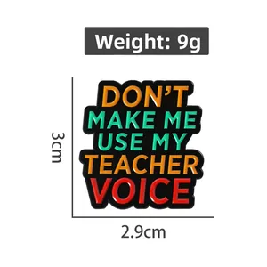 Detail view of enamel badge with 'Don't make me use my teacher voice' text and dimensions