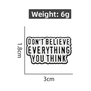 Black and white enamel pin with inspirational quote measuring 3cm by 1.8cm weighing 6g