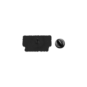 Detail of matte black rubber clutches and metal pin backings for enamel pins
