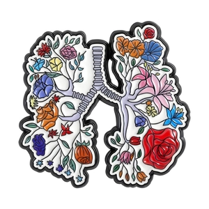 Creative lung enamel pin with blooming colorful floral branches on white background