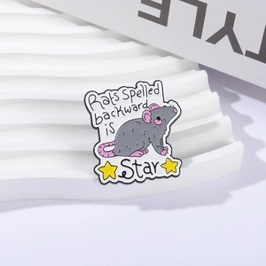 Cartoon mouse enamel pin with stars and inspirational quote on a wavy display stand