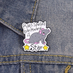Creative enamel mouse pin with Stars text design on blue denim jacket pocket