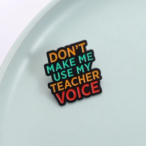 Funny enamel pin with 'Don't Make Me Use My Teacher Voice' quote on light blue dish