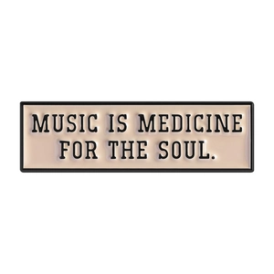 Music Is Medicine For The Soul enamel pin badge with embossed black text on beige