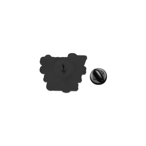 Close-up of black enamel brooch back with metal pin and secure rubber clutch backing