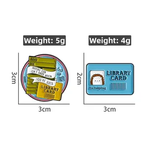 Detail view of library theme enamel pins showing book stacks and hedgehog library card design