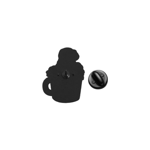 Macro view showing the back of the black matte enamel pin with rubber clutch