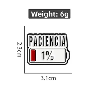 Detail view of Paciencia 1% battery enamel pin showing 3.1cm x 2.3cm dimensions and 6g weight