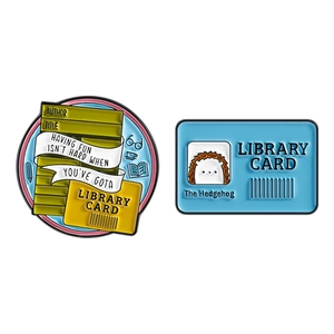 Library themed enamel pins set with library card and hedgehog design on white background