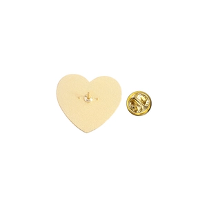 Macro shot of gold heart-shaped badge back with secure butterfly clutch pin backing