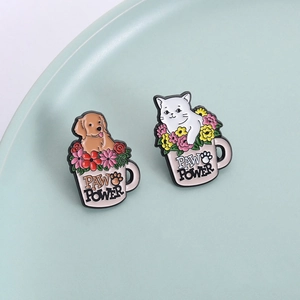 Cute enamel animal pins with Paw Power slogan cat and dog designs in pink flower cups
