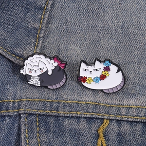 Funny enamel pins set featuring a judge cat in a wig and a cute cat wearing a flower garland