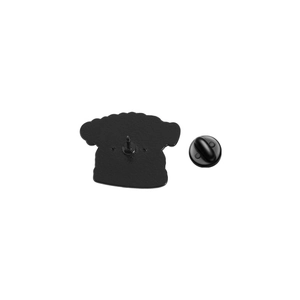 Detail view of the black enamel pin back with a secure black rubber clutch fastener