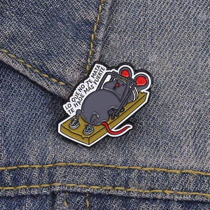 Fitness mouse enamel pin with Spanish motivational quote on blue denim fabric