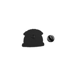 Detail view of the black enamel brooch back with a secure black rubber clutch closure