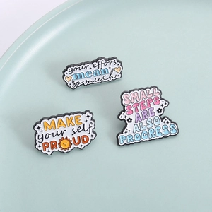 Three-piece colorful inspirational quote enamel pins set with motivational text for apparel