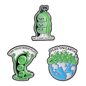 Set of three cartoon green pea enamel pins with creative pun sayings on white background