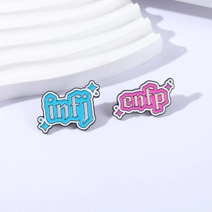 Colorful MBTI metal enamel pins featuring INFJ and ENFP lettering with star patterns