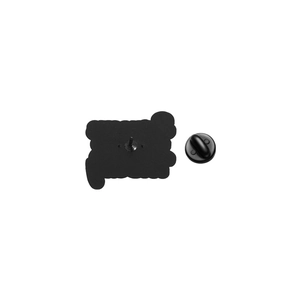 Detail view of the enamel pin back with a black rubber clutch and secure metal pin needle
