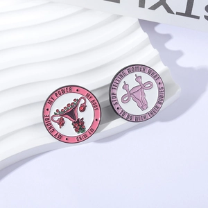 Feminine power enamel pins with floral uterus design and My Body My Choice slogan
