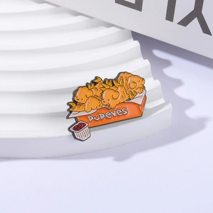 Cute golden retriever enamel pin featuring a french fry chicken box with puppy shapes