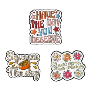 Motivational enamel pin set featuring citrus fruits and inspirational English quotes