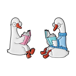 Cute enamel pins set featuring white goose and duck reading books for bags and clothing