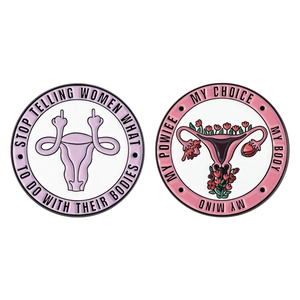 Enamel uterus pins with My Body My Choice and Stop Telling Women slogans for women