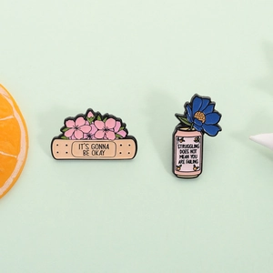 Positive energy enamel pins set with healing flowers and inspirational slogans