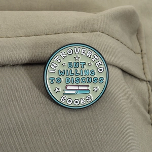 Introverted But Willing to Discuss Books mint enamel brooch for book lovers on fabric
