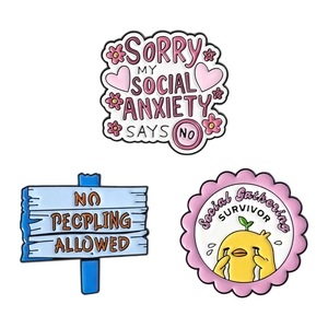 Three-piece enamel pin set with social anxiety theme featuring a sad yellow duck design
