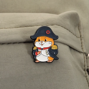 Detailed close-up of a cartoon hamster enamel pin in black military officer uniform on canvas