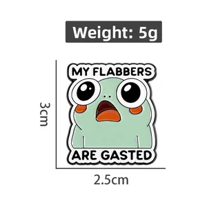 Detail showing cartoon frog enamel pin dimensions 3cm by 2.5cm with funny text