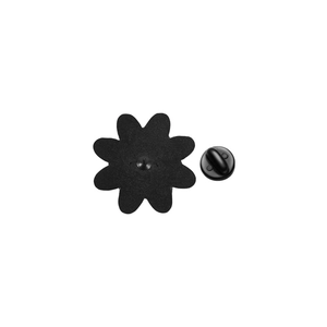 Macro detail of the floral metal pin back and black rubber clutch attachment