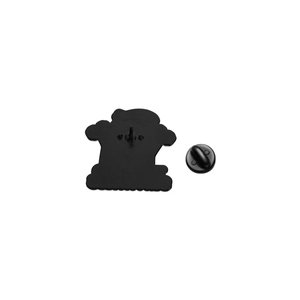 Detail view of the metal enamel pin back with a black rubber clutch fastener