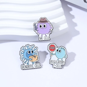 Cartoon immune cell enamel pins featuring NK cell, Dendritic Cell and T-cell designs