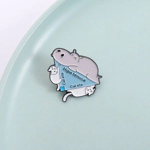 Funny math enamel pin with hippo and cats showing hypotenuse geometry concept on blue plate