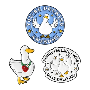 Three cute cartoon duck enamel pins set with funny quotes on a clean white background