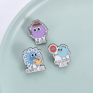Cartoon biological cell enamel pins featuring NK, regulatory T, and dendritic cells on a ceramic plate