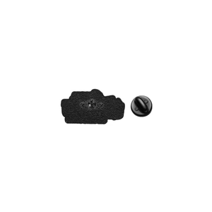 Detail of the black enamel badge back featuring sandblasted finish and rubber clutch