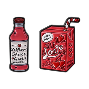 Pink drink bottle enamel pins featuring Selflove Sauce and Juice artistic designs