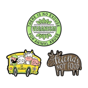 Three-piece vegan enamel pin set featuring cute animals and Friends Not Food slogans