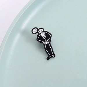 Spilla divertente a forma di scheletro con fumetto su piatto in ceramica verde